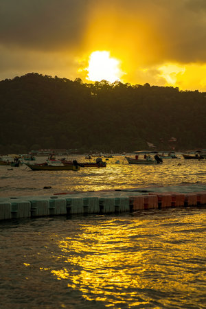 Terengganu, Malaysia - March 16, 2023 Golden sunrise in Perhentian Island.のeditorial素材