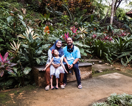 Family taking photo together in the rainforest jungle near Kelam cave.の写真素材