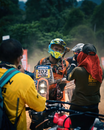 Pahang, Malaysia - Sept 24, 2022 Happy motorcyclist at the finished line of practice.のeditorial素材