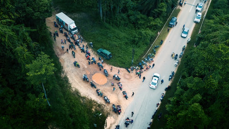 Pahang, Malaysia - Sept 24, 2022 Aerial view of the motorcyclist entering the enduro motorcycle...