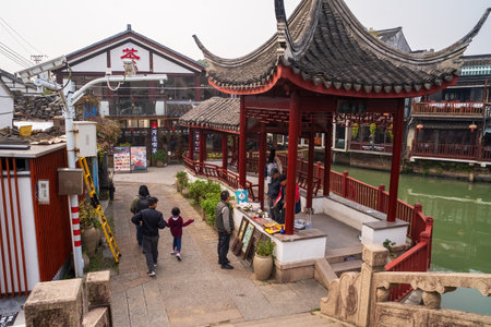 Shanghai, China - December 7, 2024 Local tourist walking exploring the Zhujiajiao Old Town shops.
