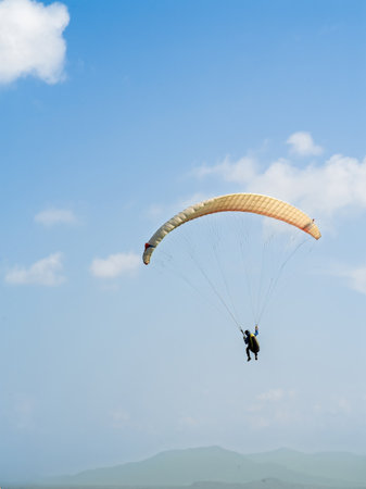 Paragliding in Bukit Bubus, Besut Terengganu. Bukit Bubus is famous for the extreme sports due to its location near the beach.の写真素材