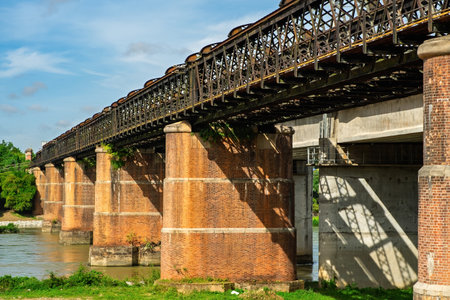 A large brick and stone masonry arch bridge over the Kuala Kangsar river in Malaysia.の写真素材