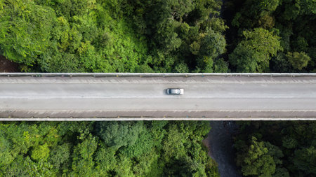car moving on the elevated road across the rainforest mountains in Hulu Selangor, Malaysia.の写真素材