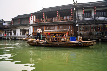 Blurry photo of tourists on boat at the canal of Zhujiajiao Old Town, the Chinese Venice.の写真素材