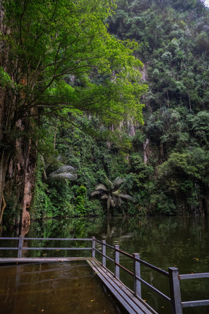 Beautiful view of Tasik Cermin, a lake with reflected view of surrounding in Ipoh, Malaysia