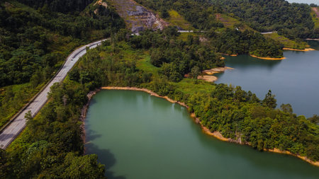 Green lake and rainforest tropical trees in Kuala Kubu Bharu, Malaysia.の写真素材