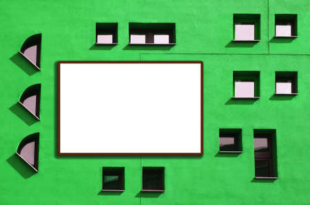 Green background with Windows and a white frame for your text.Facade with many small atypical...