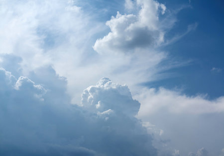 Nice sky with fluffy clouds. Abstract background, wallpaper with blue and white sky with cumulus clouds.の写真素材