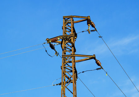 Electric pylon with electric wires on landscape background. Retro high voltage electrical power...