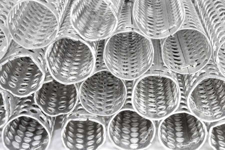 Metallic curlers close-up. Object over white.