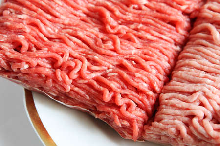 Raw minced beef and pork on a plateの写真素材