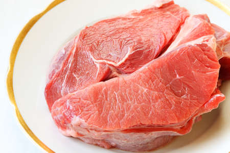 Good lean cut of  raw beef on china ware 