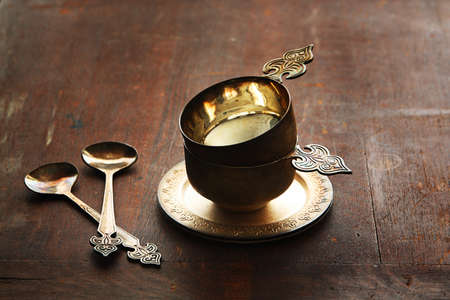 German silver coffee cups on a old brown backgroundの写真素材