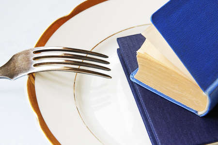 Two books on a china as a conceptual foodの写真素材