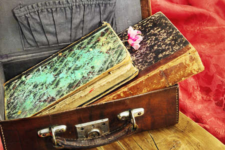 The old book in a vintage leather suitcaseの写真素材