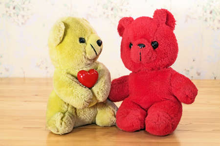 Frienfship among toys, yellow bear and red bearの写真素材