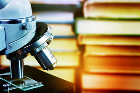 Microscope against a background of booksの写真素材