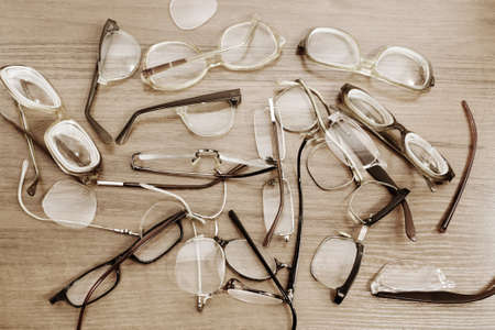 A lot of various broken glasses for readingの写真素材