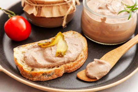 Homemade Chicken Liver Pate with Pickled Cucumber and Tomato and Fresh Crispy Whole Grain Breadの写真素材