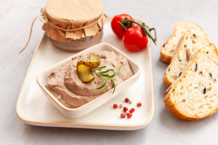 Homemade Chicken Liver Pate with Pickled Cucumber and Tomato and Fresh Crispy Whole Grain Breadの写真素材