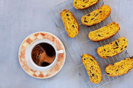 Close up of Italian biscotti and cup of coffee on light grey background.の写真素材
