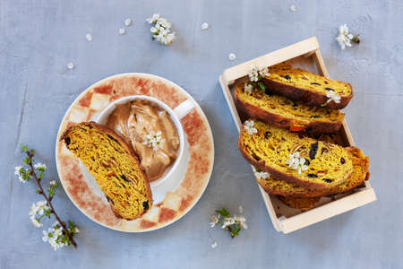 Cup of Trendy whipped cream dalgona coffee and Italian biscotti on light grey background.の写真素材