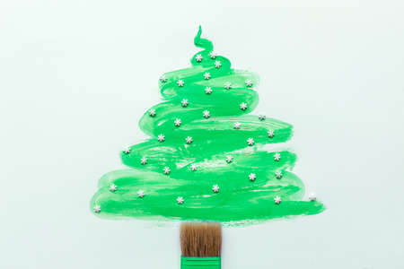 Christmas tree hand draw with sugar snowflakes and brush isolated on white backgroundの写真素材
