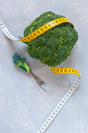 Broccoli and centimeter. Fresh egetable, concept for weight loss, diet, ketogenic diet, intermittent fastingの写真素材