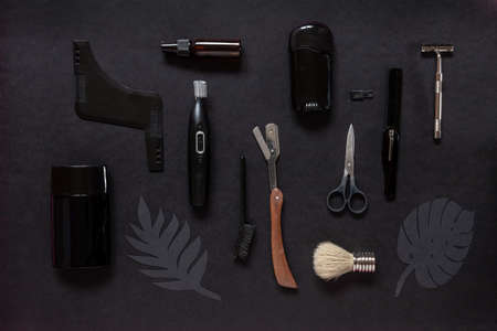 Top view of various men shaving accessories and body care on black backgroundの写真素材