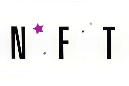 NFT inscription on white background. Close-up, top view, copy space.の写真素材