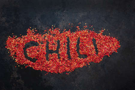 Chili lettering from dry chili flakes Hot red seasoning, Spicy revolutionの写真素材