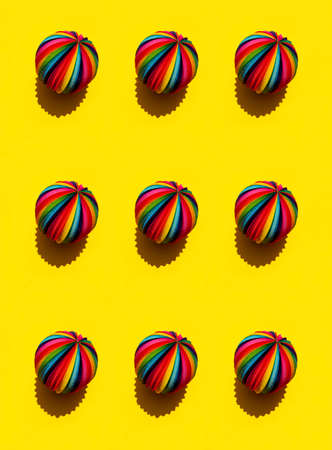 Geometric pattern of Rainbow Sphere on a bright yellow background, top view