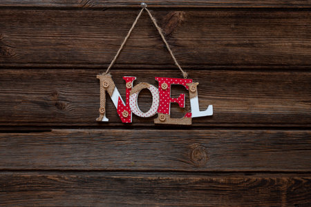Word NOEL from wooden letters on vintage wooden background. Christmas conceptの写真素材