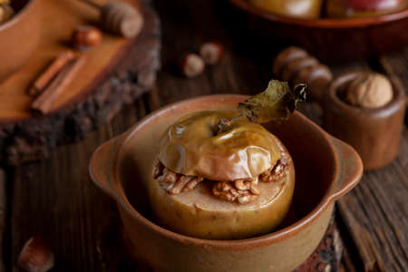 Baked apples with cinnamon stuffed with walnuts