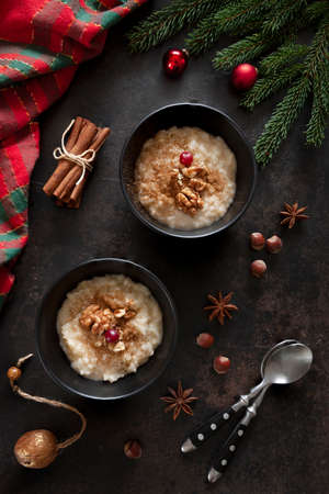 Traditional Scandinavian-style rice porridge, pudding in Christmas style with decoration, close up, top view, flat layの写真素材
