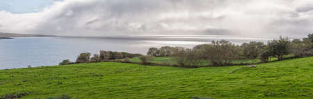 Panoramic view of green grassy coast near Dunkineely County, Donegal, Ireland, Atlantic Ocean