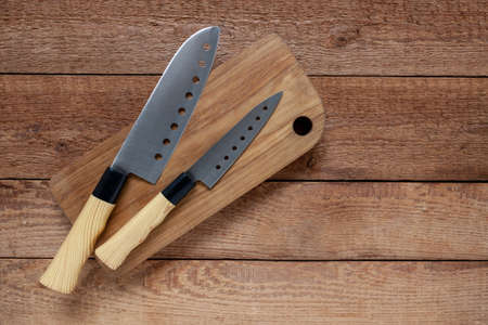 Set of kitchen knives with wooden handle, top view, close upの写真素材
