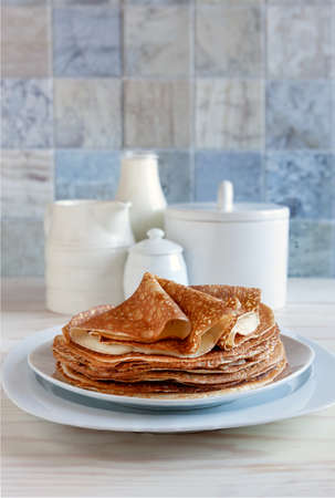 Traditional homemade pancakes. Celebration of Maslenitsa. Close-up, selective focus.