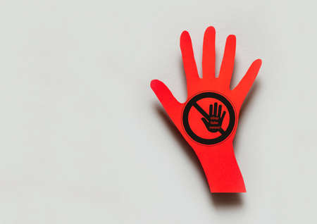 Concept Stop fake news. Stop sign on paper red hand backgroundの写真素材