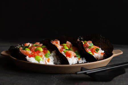 Trendy Hybrid Food Sushi Tacos with salmon, rice and edamame beans.の写真素材