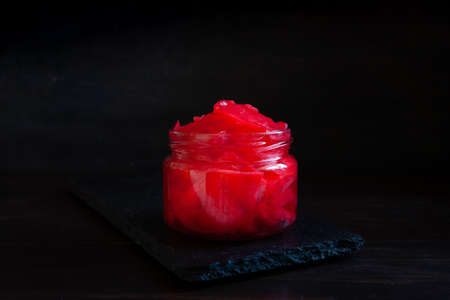 Close-up of red colored organic Cabbage in glass jars, fermented with seasonings and beet red juice.の写真素材
