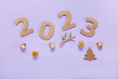 2023 Year Golden Number Text on trendy lavender Background with festive decorations
