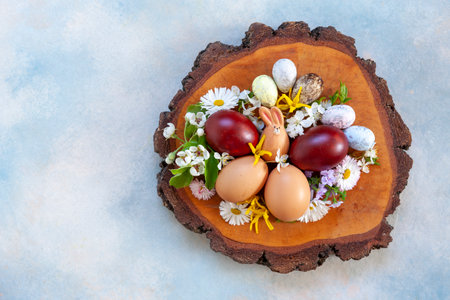 Easter background decoration Easter eggs, bunny fugurine and spring flowers. Top view, close up, flat layの写真素材