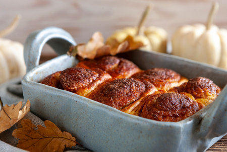 Homemade pumpkin buns, cinnabon. Autumn, Halloween, Thanksgiving Food Concept.の写真素材