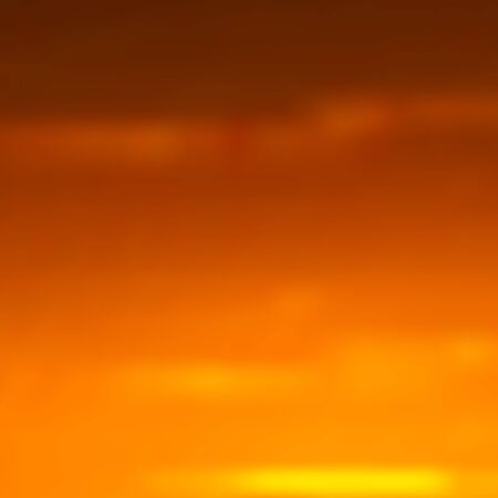Blurred background in orange and red-brown colors, bright African sunset. Great as a background for a poster, web pages, gift wrapping design, any printed materials, advertising, or other design.のイラスト素材