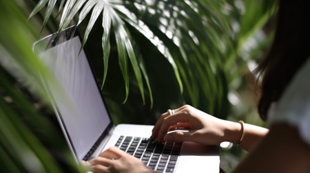 Young business woman working at the computer on beach with tropical palm. Young girl downshifter...