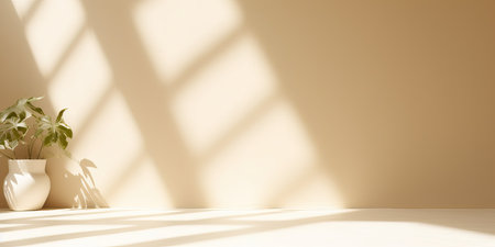 Minimalistic abstract gentle light beige background for product presentation with light andand intricate shadow from the window and vegetation on wall.の写真素材