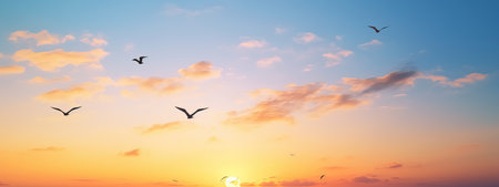 abstract beautiful peaceful summer morning sky background, sunrise new day and flying flock of birdsの素材