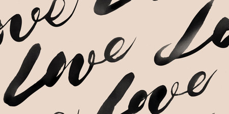 Hand-painted brush script seamless pattern of the word love in black ink calligraphy on a textured...